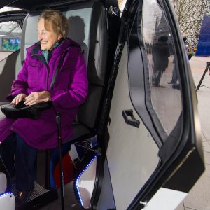 EDITORIAL USE ONLY Brenda Stevenson, 82, from Greenwich sits inside a prototype of the Pathfinder driverless pod, that will be the first autonomous vehicle in the UK to work on public footpaths, which has been unveiled today by the Transport Systems Catapult at a Government launch event in Greenwich, London. PRESS ASSOCIATION Photo. Picture date: Wednesday February 11, 2015. The electric-powered vehicles can seat two people and are designed to work on pavements and pedestrianised areas. They are being built by RDM Group; one of the UK’s fastest growing advanced engineering companies, and will be equipped with sensor and navigation technology provided by the University of Oxford's Mobile Robotics Group. Photo credit should: Dominic Lipinski/PA Wire